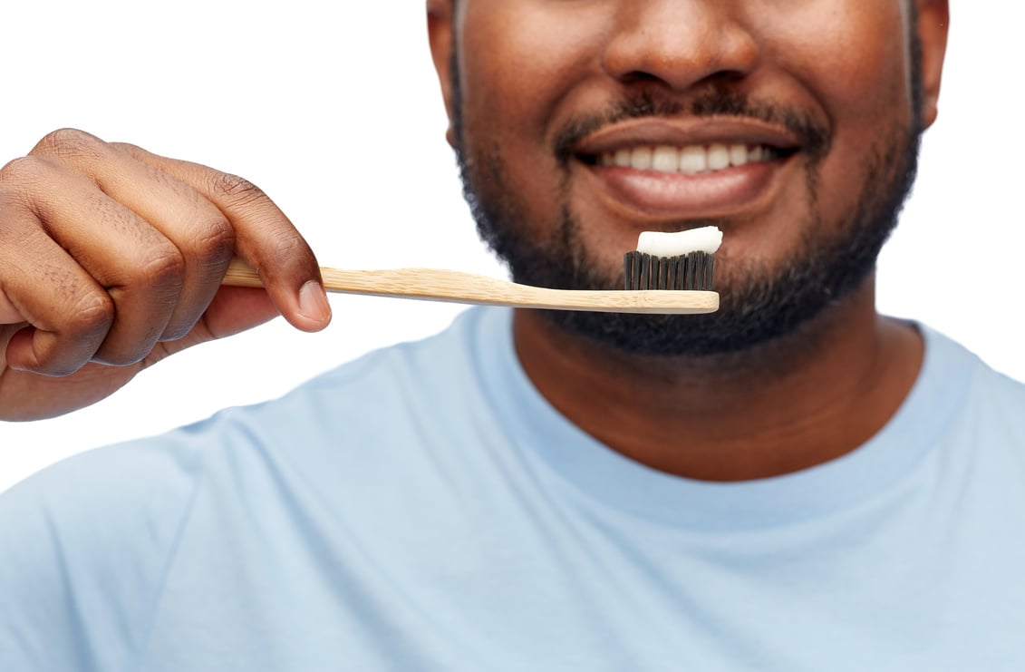 Smiling African Man with Toothbrush Cleaning Teeth